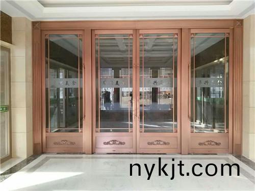 玻璃四开地弹铜门